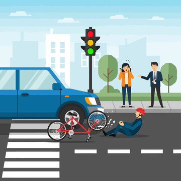 Car accident with injured cyclist on crosswalk, traffic light red