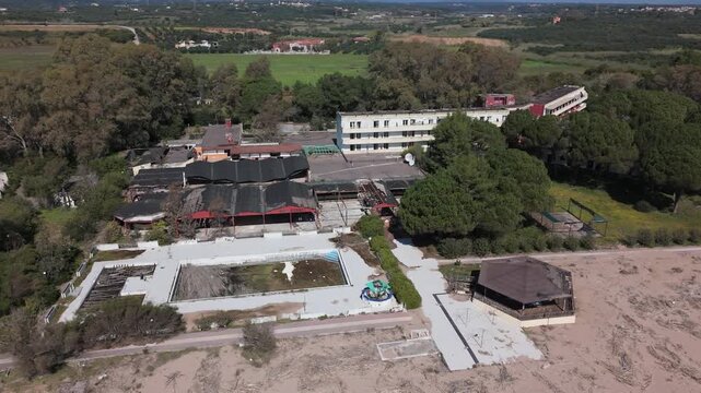 Aerial View of Abandoned Beachfront Hotel on Sandy Coast Near Kalamata