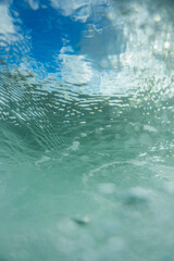 Fototapeta premium underwater surface view with clouds and ripples