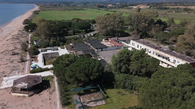 Aerial View of Abandoned Beachfront Hotel on Sandy Coast Near Kalamata