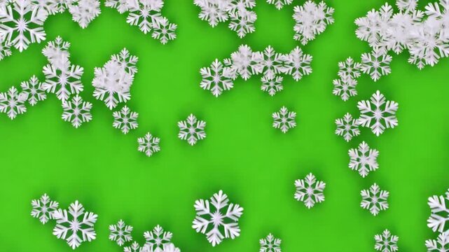 Snowflakes falling on green background with white space