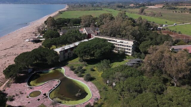 Aerial View of Abandoned Beachfront Hotel on Sandy Coast Near Kalamata