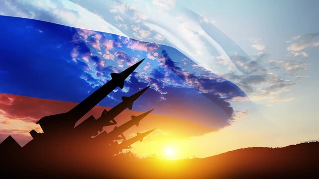 The missiles are aimed at the sky at sunset with Russian flag. Nuclear bomb, chemical weapons, missile defense, a system of salvo fire.