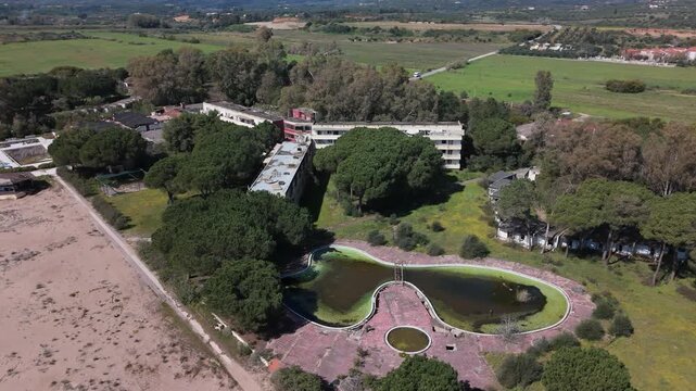 Aerial View of Abandoned Beachfront Hotel on Sandy Coast Near Kalamata