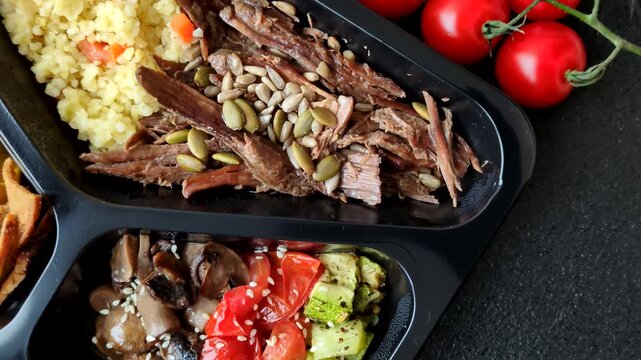 A bowl with beef, porridge, mushrooms, vegetables, sauce, and spices. Beef bowl as a food background for your design