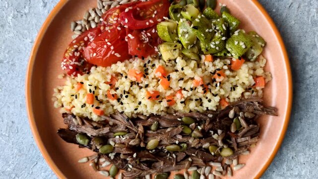 A bowl with beef, porridge, mushrooms, vegetables, sauce, and spices. Beef bowl as a food background for your design