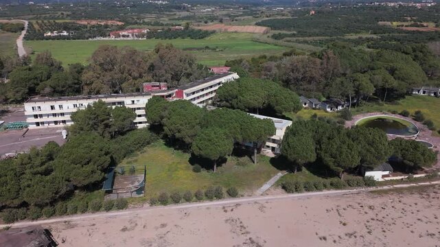 Aerial View of Abandoned Beachfront Hotel on Sandy Coast Near Kalamata