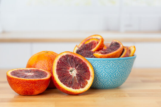 Blood Oranges on a Kitchen Counter, Whole, Halves, and Sliced