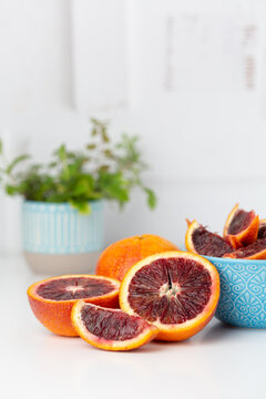 Blood Oranges on a Kitchen Counter, Whole, Halves, and Sliced