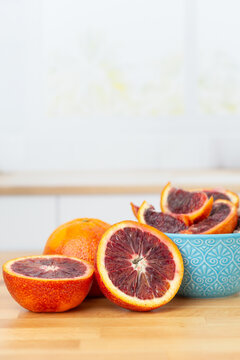 Blood Oranges on a Kitchen Counter, Whole, Halves, and Sliced