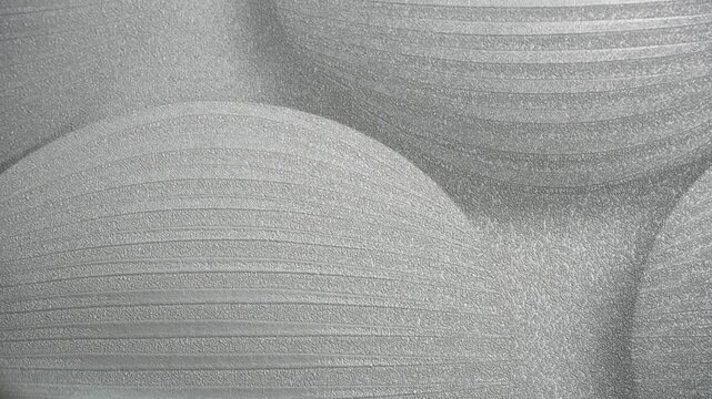 Close-up view of a catalog featuring various wallpaper samples for wall decoration. Concept of interior design and home renovation