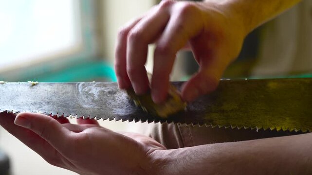 Rubbing a metal saw blade with wax, whispering metallic rustle, ASMR sound
