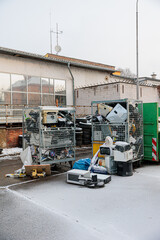 Naklejka premium Electronic Waste Recycling Yard With Dumpsters, Old Appliances And Scrapped Electronics