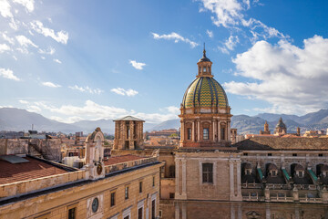 Obraz premium Scenic view of the colorful Majolica tiled dome of Chiesa del Carmine Maggiore overlooking the rooftops of Palermo, Sicily