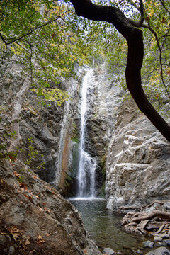 Kalidonia Waterfall Flowing Between Rocky Cliffs in Cyprus