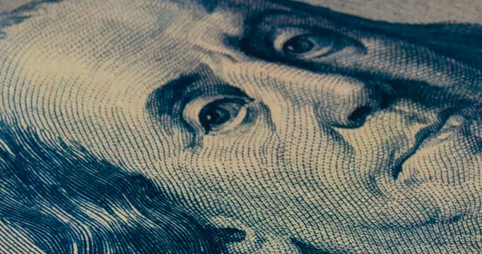 A zoom in to the eye of a Benjamin Franklin portrait poster