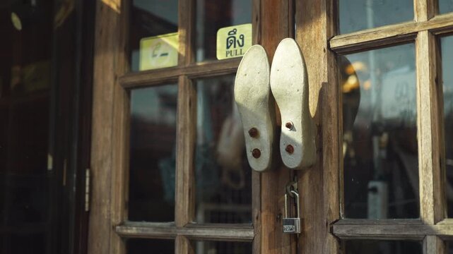 A detailed view of two legs knockers with the pull sticker on the door