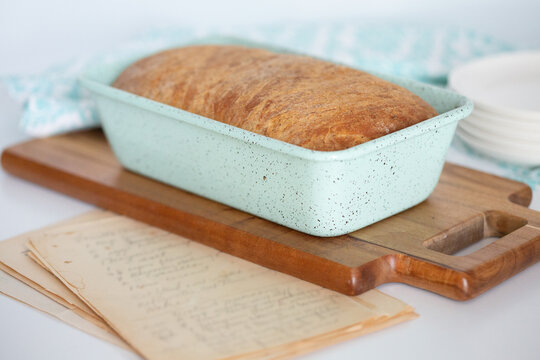 Freshly Backed Pain de Mie on a Cutting Board on a White Background