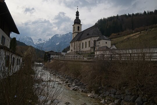 famous viewpoint in Ramsau over the Ramsauer Ache river to the parish church of St. Sebastian