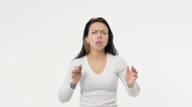 Young adult woman looks shock curiously fearfully white background isolated space