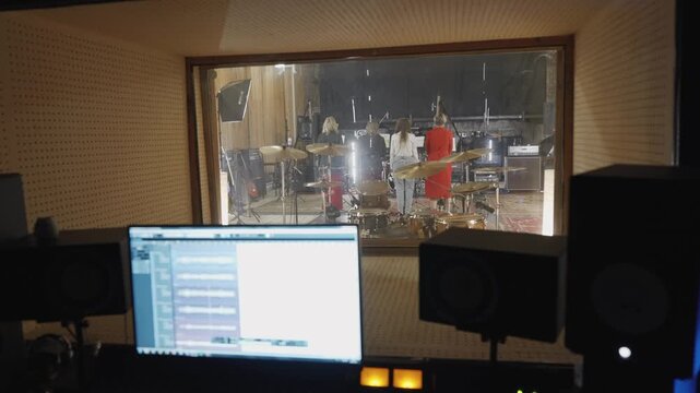 Recording environment with artists and sound technicians at work