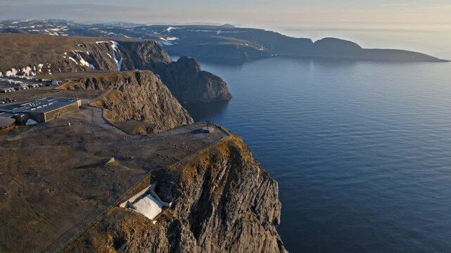 Aerial view of the Nordkapp visitor centre and cliff edge on Mager&oslash;ya Island, Norway. Dramatic Arctic landscape overlooks the endless Barents Sea.