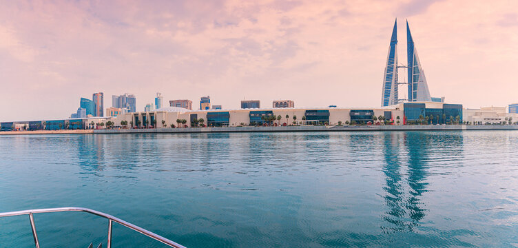 4 December 2025, Bahrain, Manama: World Trade Center and The Avenues Mall, developing waterfront area at sunset