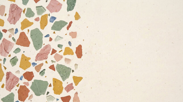 Modern minimalist terrazzo background with colorful stone chips on the left and large empty copy space on the right. Creamy pastel texture for interior design and typography
