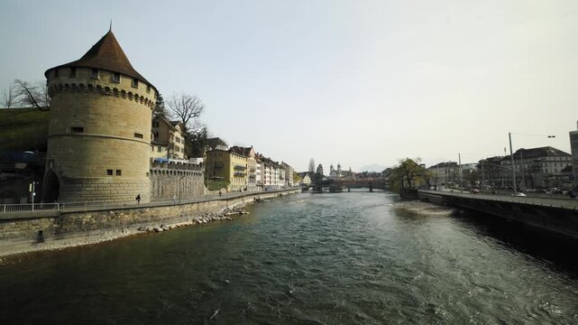 Historic Noelliturm watchtower over the Reuss river and the cityscape of Lucerne Switzerland