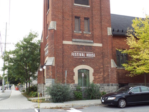 Ottawa, Ontario, Canada-July 22, 2025: "Festival House", a historic red brick former church building in Westboro, stands prominently at the corner of Churchill Avenue North.