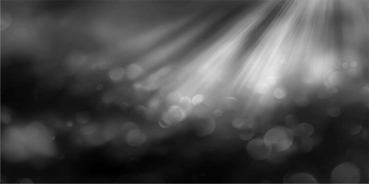Abstract ethereal grayscale image of light rays, casting down, illuminating the dark, adding a sense of mystery and depth. The image captures the contrast of light and shadow.