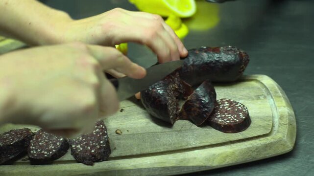Cutting slices of black pudding blood sausage Ireland food