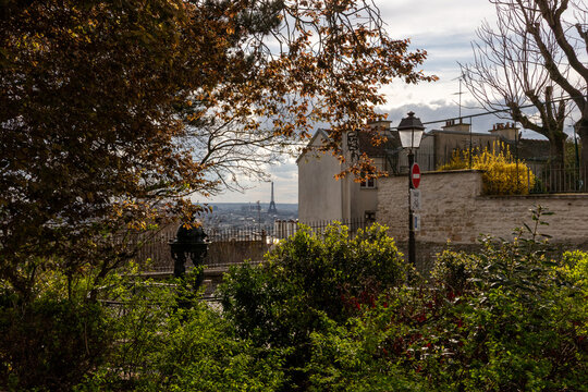 View Across Paris from Montmartre with Rooftops, Eiffel Tower and Dramatic Sky.