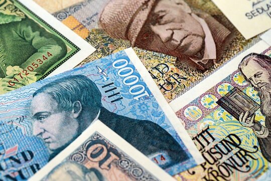 Icelandic krona money bills pile on table. Iceland banknotes of ISK currency close up. Concept of business, economy and banking in Iceland
