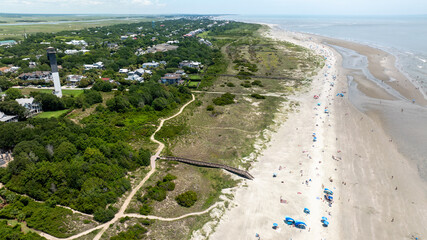 Panoramic Aerial view of Sullivan's Island beach landscape near Charleston, South Carolina showcasing the beachgoers, coastline, and residential areas along the shoreline of Atlantic Ocean © Josh-Lehew