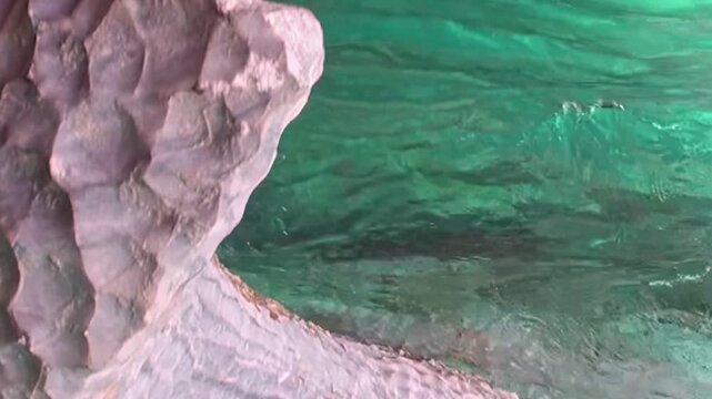 Glimpse the stunning formations within Patagonia's Marble Caves. Emerald waters elegantly caress the smooth, unique textures of the rock, showcasing timeless beauty and tranquil depths.