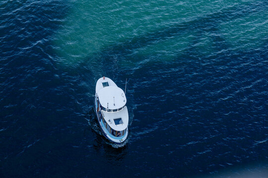  Aerial view from Burrard Bridge of a small passenger ferry crossing False Creek