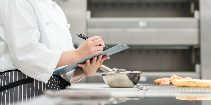Female staff in the kitchen who check, research, develop products, manage hygiene and quality control for bread.