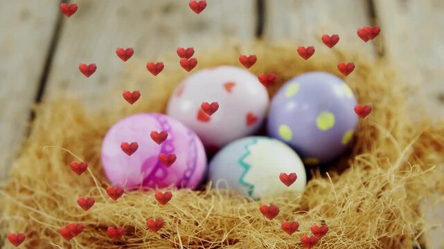Camera pulling back revealing pastel eggs in nest, heart overlays multiplying to celebrate spring