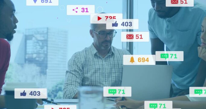 Team lead typing and pointing causing animated badges appearing over laptop in business meeting