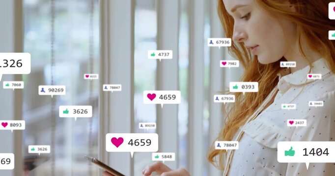 Woman reacting to social media alerts lifting device and tapping spawning heart and follower badges