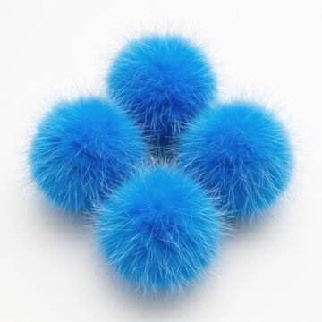 Four blue fuzzy pom poms on white background