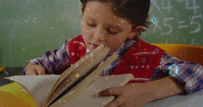 Boy student leaning and turning pages at desk, studying math with binary overlay drifting over book