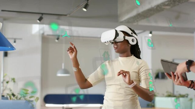 Woman wearing VR headset activating tech UI, testing green icons while man guiding tablet