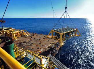 A subsea module is lowered from a barge into Bass Strait during offshore construction. © KRUTOPIMAGES