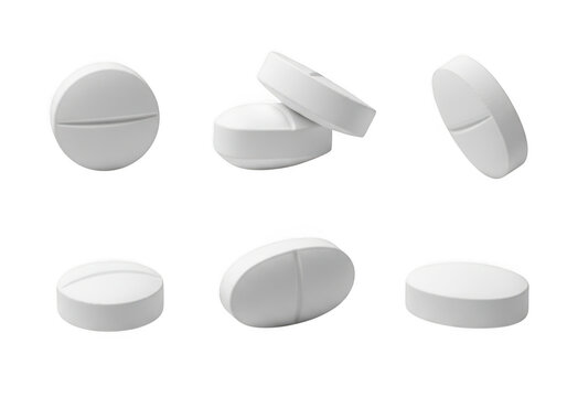 A set of white pills in different orientations