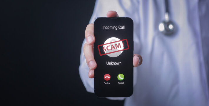 Medical doctor holding smartphone displaying suspicious phone call from an unknown scammer conveying cautious warning emotion