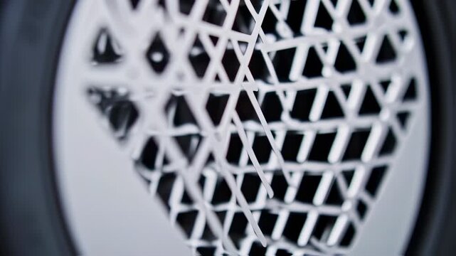 Close-up of a complex, geometric, metal grille