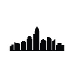 Obraz premium A silhouetted cityscape featuring a prominent central skyscraper