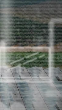 Vertical video: Cam moving down, vents filling as blinds banding glass, screen growing for roofing